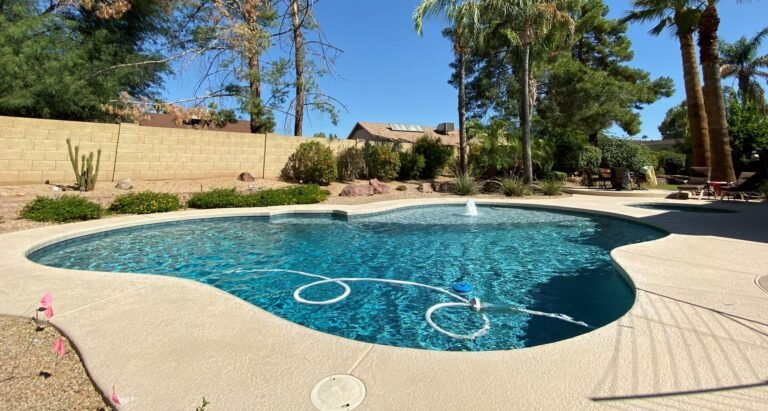 Residential swimming pool with a pebble finish in a Phoenix Arizona desert backyard